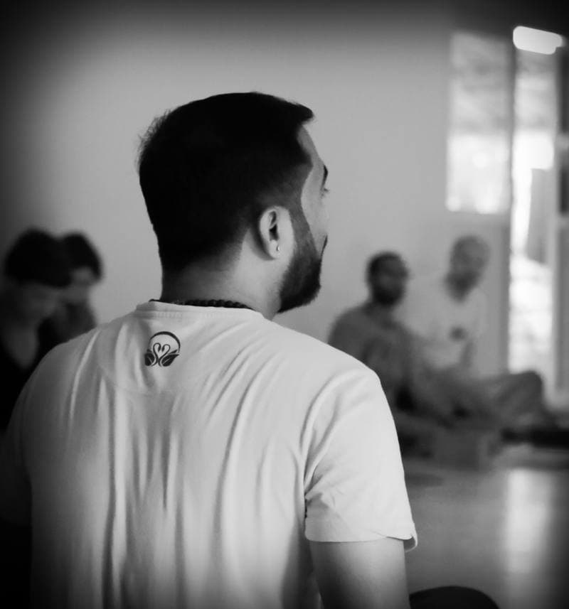 Aravind Prasad Teaching — Samyut Yoga Logo, Students in Background